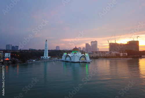 Aerial view of Majestic Malacca Straits Mosque during sunset.