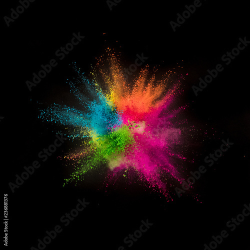 Colored powder explosion on black background.