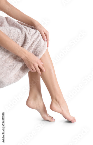 Woman with beautiful legs and feet on white background  closeup. Spa treatment