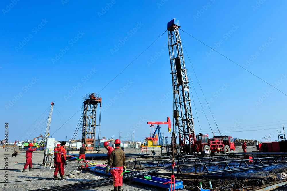 Oil field oil workers at work