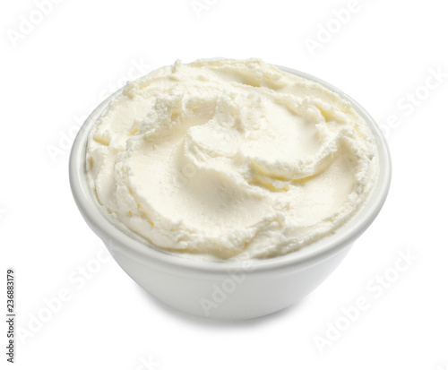 Bowl of tasty cream cheese on white background