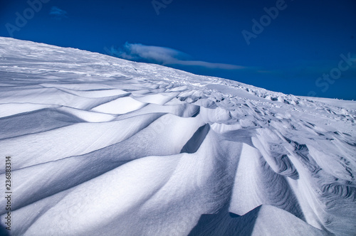 Waves in the snow in the mountains