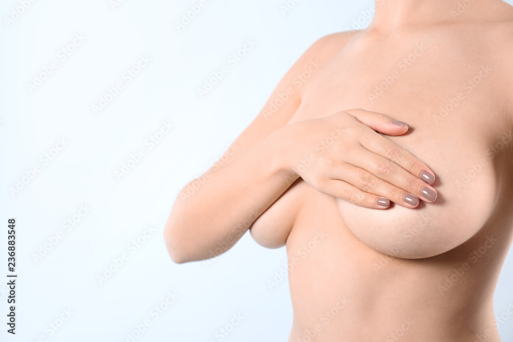 Woman covering her breast and space for text on white background, closeup. Self examination