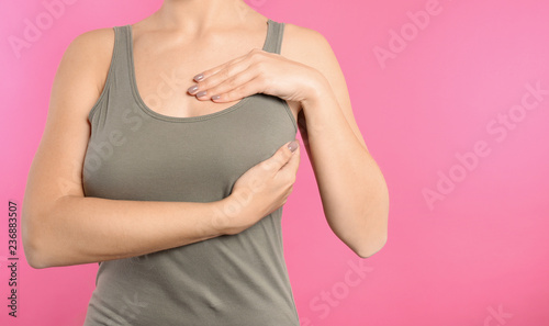Wallpaper Mural Woman checking her breast on color background, closeup. Space for text Torontodigital.ca