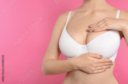 Wallpaper Mural Woman checking her breast on color background, closeup. Space for text Torontodigital.ca