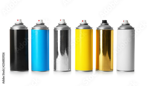Cans of different spray paints on white background