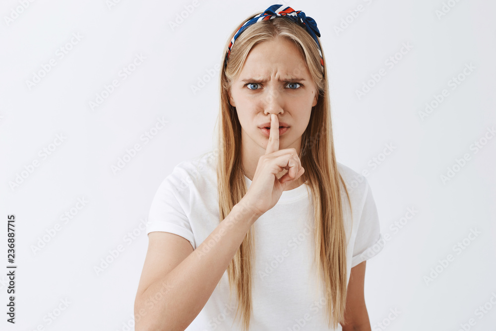 How can you say that, shut up. Angry and upset european fair-haired woman  shushing at man showing disrespect, being disappointed and outraged,  showing shh gesture with index finger over mouth Stock Photo |