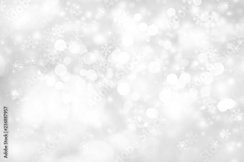 white snow blur abstract background. Bokeh Christmas blurred beautiful shiny Christmas lights. white and gray winter backdrop.