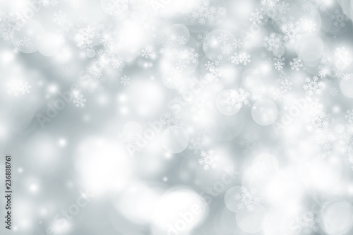 white snow blur abstract background. Bokeh Christmas blurred beautiful shiny Christmas lights. white and gray winter backdrop. © ooddysmile
