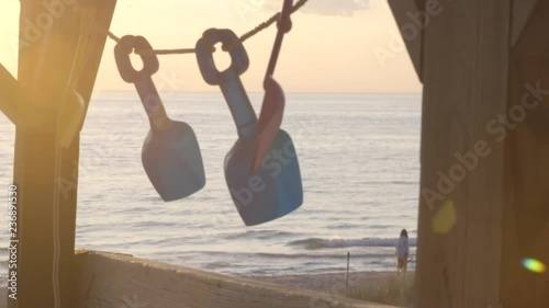 Beach decorations against a lake sunset