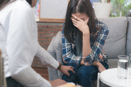 psychologist talking with depressed patient about mental condition.