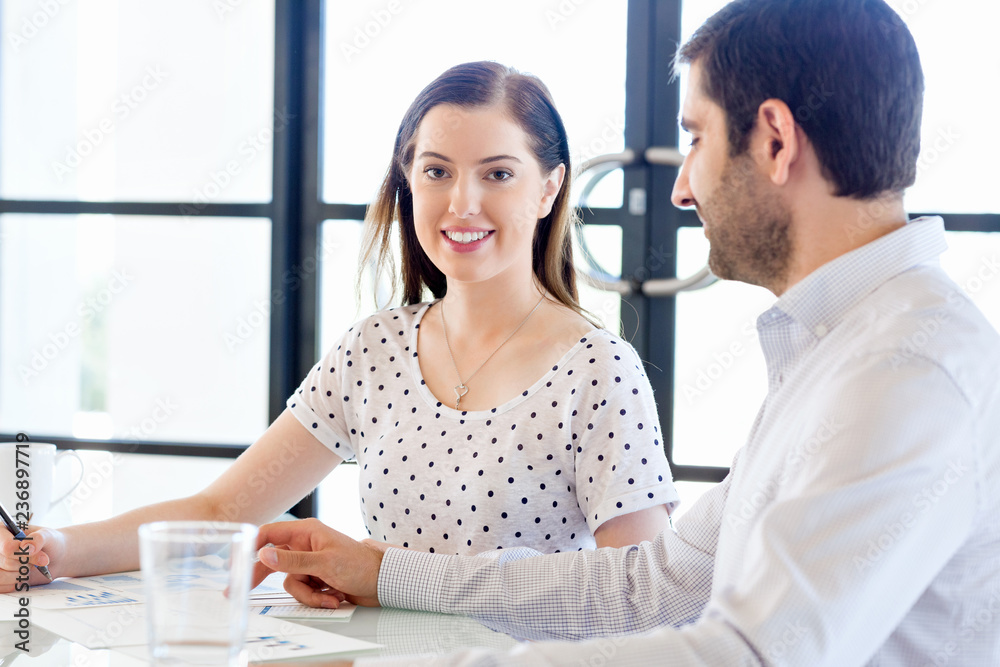 Fototapeta premium Image of two young business people in office
