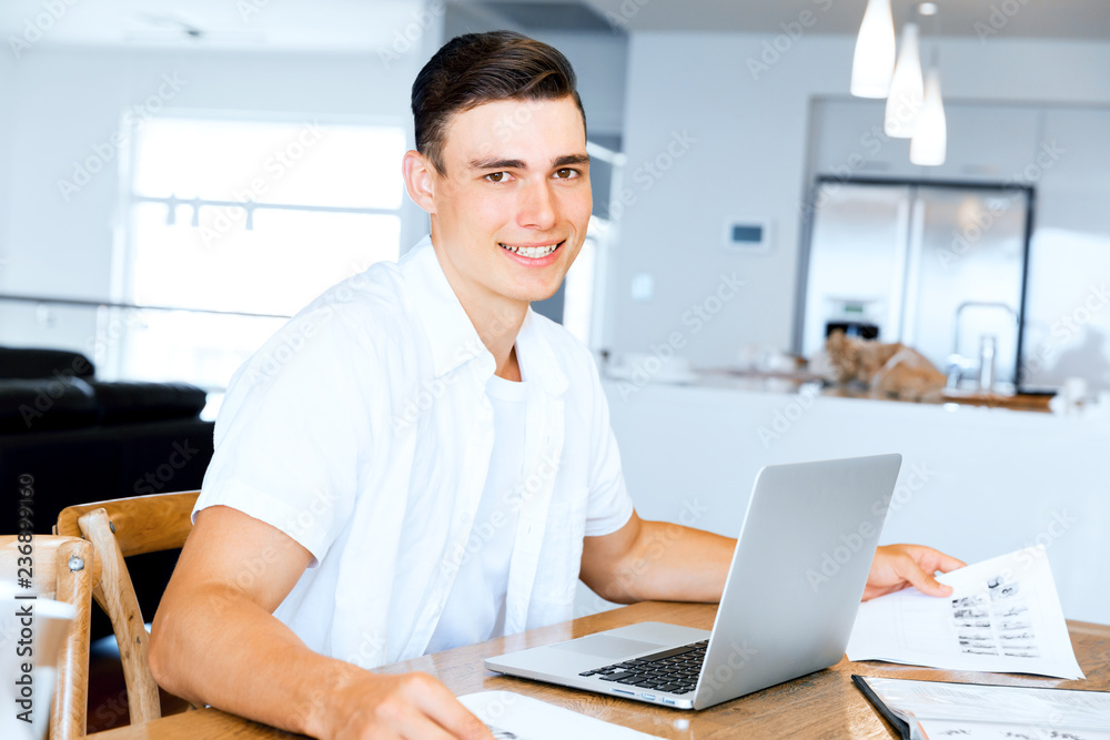 Man working on laptop at home Man working on laptop at home