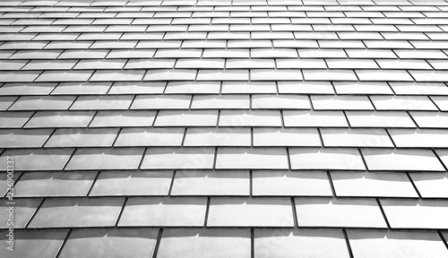 White tile roof floor texture background. Closeup roofing pattern materials to build a house for sun and rain protection with rays light.