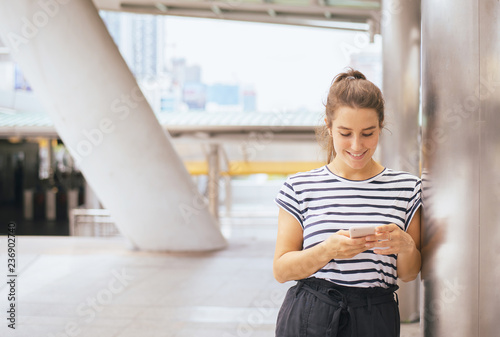 Woman using mobile phone conection internet,Chatting,Reading text message,Social network photo