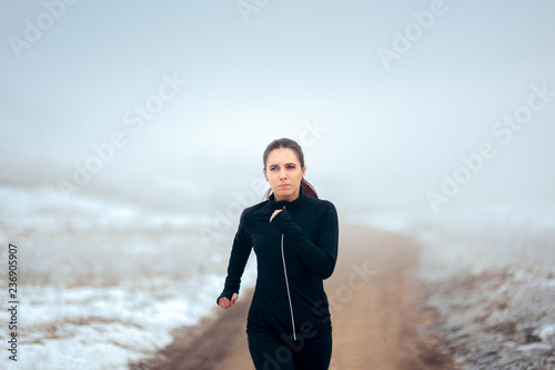 Tired Winter Runner Jogging Outside on Cold Weather