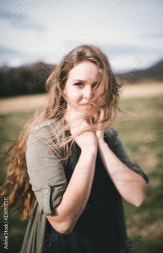 Woman with long hair, blowing in the wind