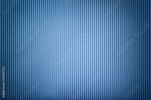 Texture of corrugated blue paper with vignette, macro.