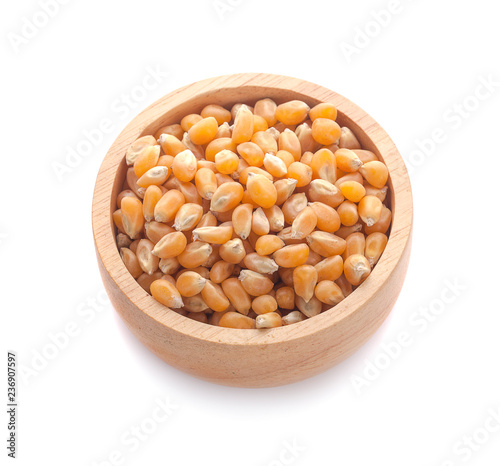 Dried yellow corn kernels on white background
