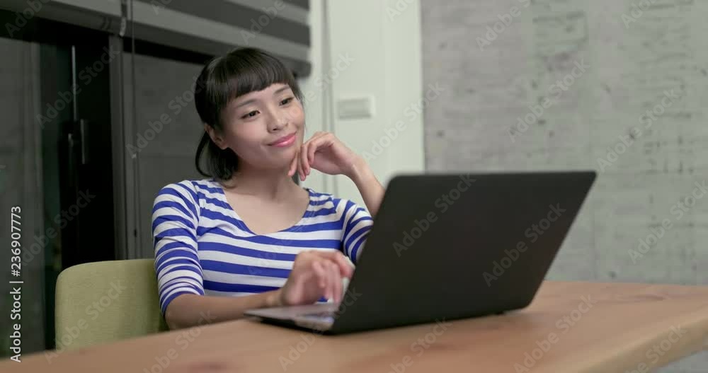Woman watch on the laptop computer Woman watch on the laptop computer