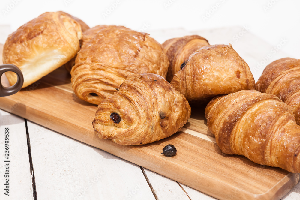 Buttercake with raisins and croissant