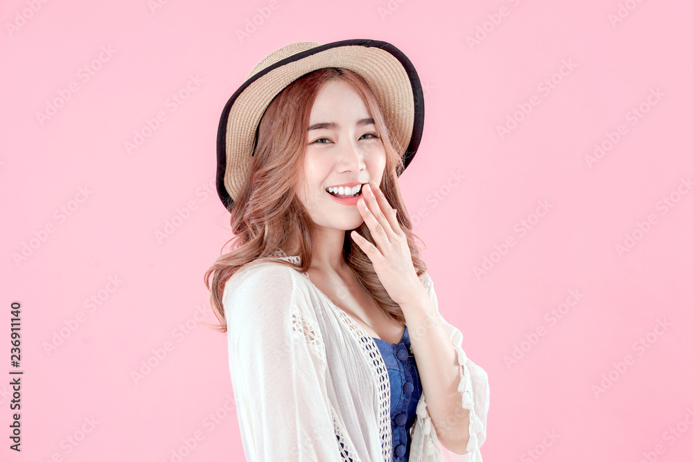 Korean woman tourist funny for gossip, summer holiday clothing, pink background Korean woman tourist funny for gossip, summer holiday clothing, pink background