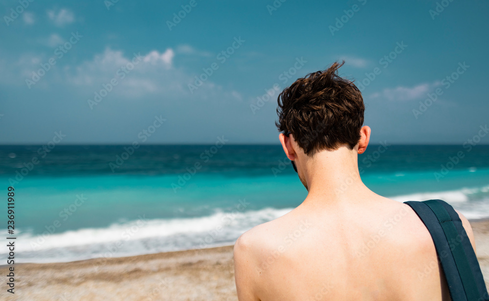 Caucasian Young Man In Front Of Tropical Sea Caucasian Young Man In Front Of Tropical Sea