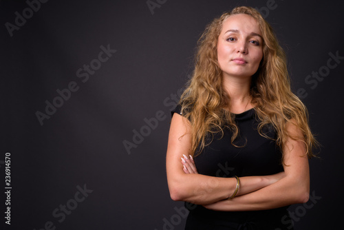 Portrait of confident businesswoman with arms crossed