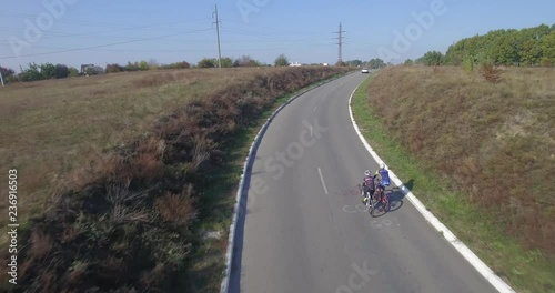 Cycling Aerial. Cyclist From Drone. Triathlon Cyclist Aerial View.Man Ride Bike On Rural Road.Healthy man cycling road bicycle outdoors fitness. photo