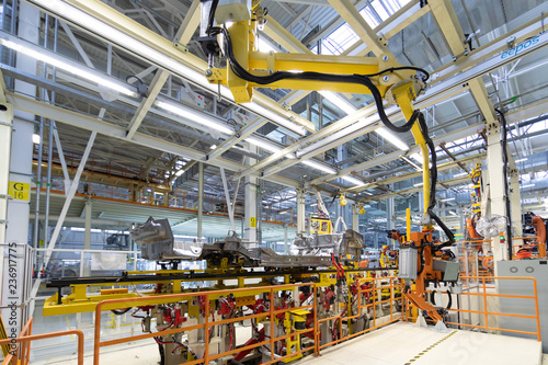process of welding cars. Modern Assembly of cars at plant. automated build process of car body