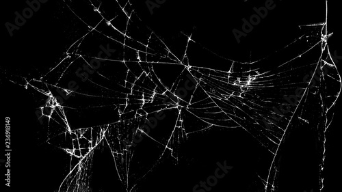 Texture of broken glass on a black background. Concept of broken automotive glass, screen phone, tablet, laptop. Flat lay, top view