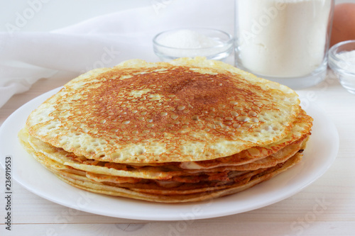 Russian pancakes on a white plate