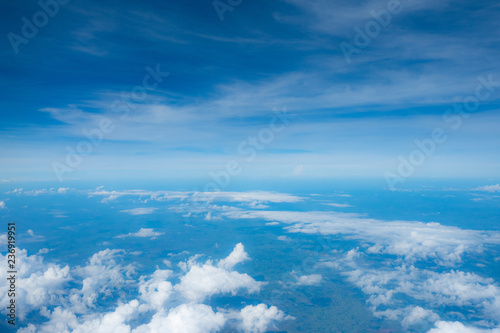 Clouds seen from an airplane, blue sunshine, soil background nature landscape