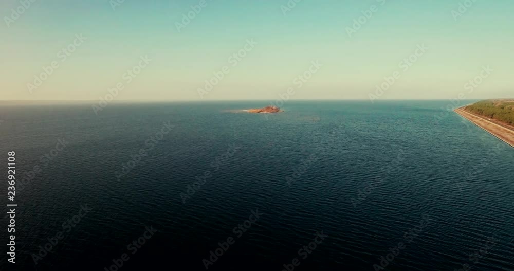 Aerial Drone small island on river and lake on autumn in golden hour.Kiev sea river island aerial drone fotage. The camera flies around the small round island. drone footage aerial view from above. Aerial Drone small island on river and lake on autumn in golden hour.Kiev sea river island aerial drone fotage. The camera flies around the small round island. drone footage aerial view from above.