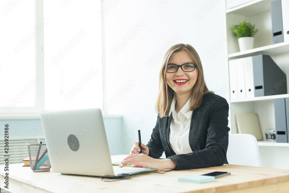 Illustrator, web designer and artist concept - Graphic designer using her pen tablet in a bright office Illustrator, web designer and artist concept - Graphic designer using her pen tablet in a bright office