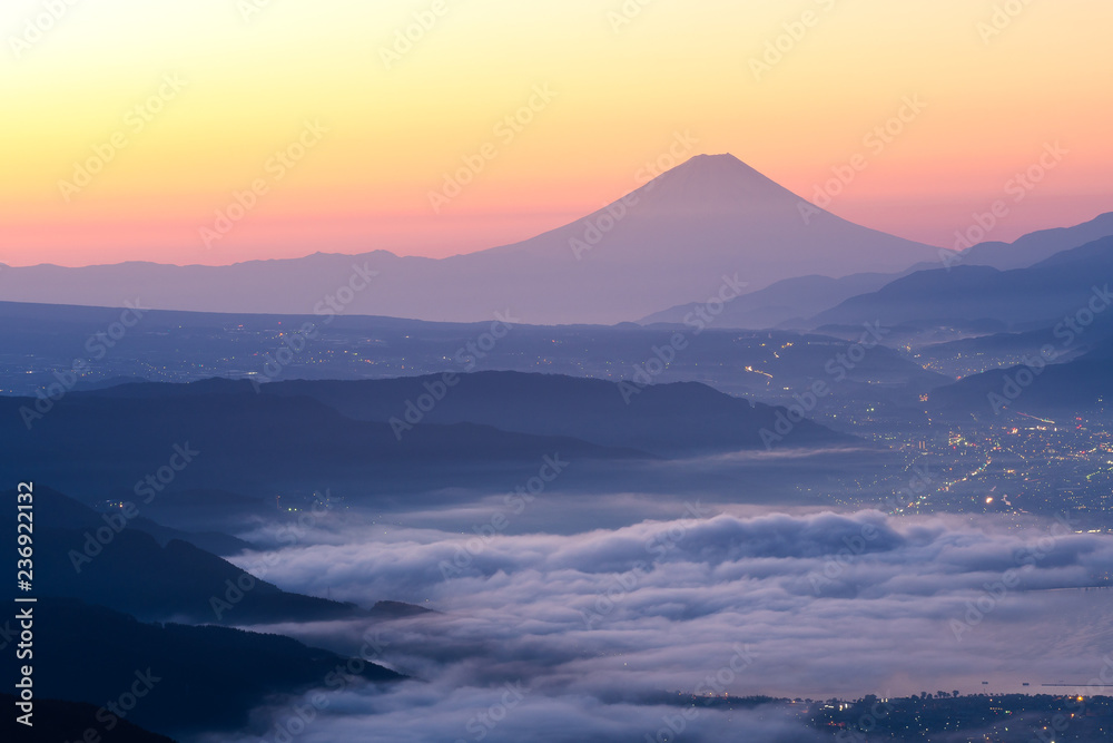 View of Mount Fuji and Sea of mist above Suwa lake in morning from Takabochi Highland, Mountain Takabochi, Nagano prefecture, Japan.