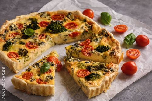 Homemade tart with broccoli, tomatoes and blue cheese.