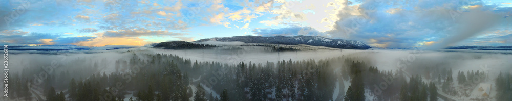 Amazing wide photo from drone above cloud with fog in the forest and sunset and clear sky above. Mountains. Cle Elum, WA state. USA