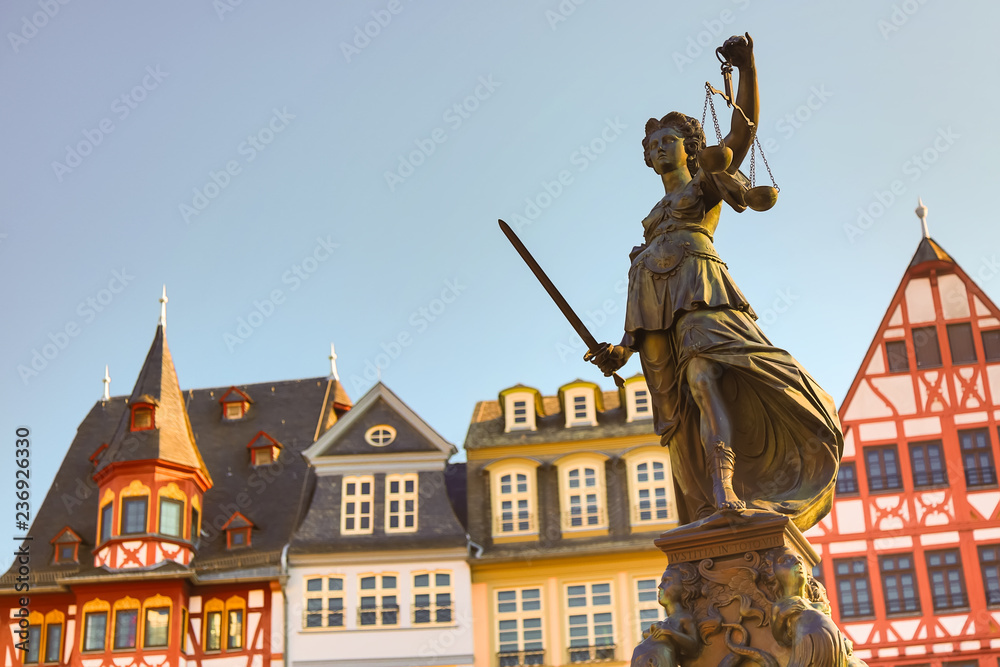 Fototapeta premium Old town square Romerberg with Justitia statue in Frankfurt Main, Germany with clear sky
