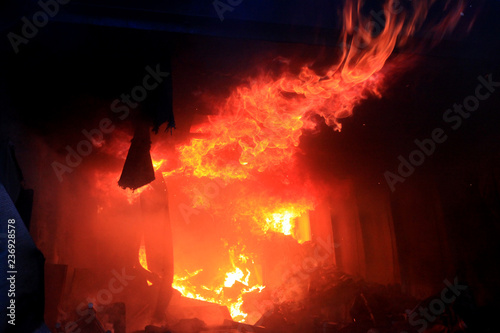 Fotografi a fire after a shell hit, War actions aftermath, Ukraine and Donbass conflict