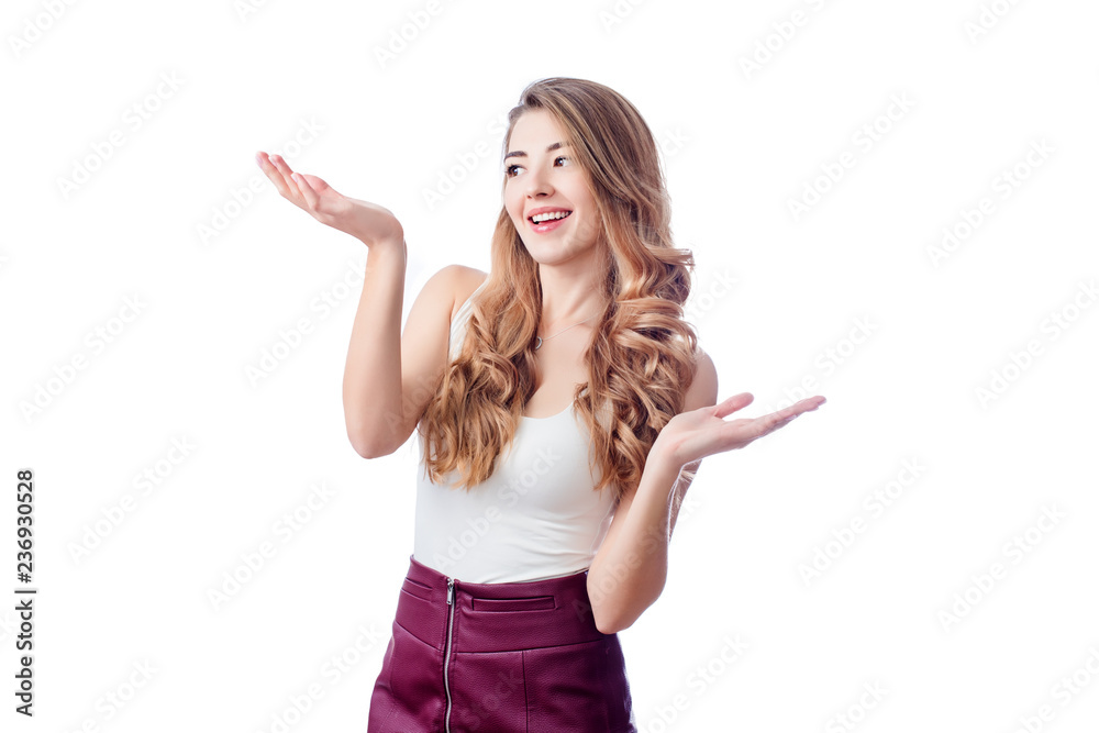 Blonde young woman standing isolated on white showing something, pointing and looking on copyspace. Compare Products. Advertising concept. Blonde young woman standing isolated on white showing something, pointing and looking on copyspace. Compare Products. Advertising concept.
