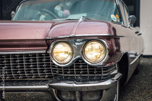 Partial closeup of a classic car from the fifties