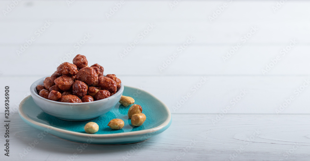 Obraz premium caramelized nuts in bowl