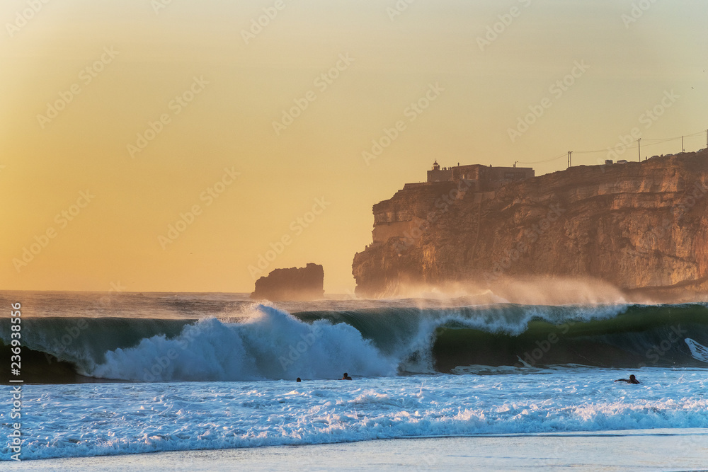 Nazare cliff in sunset time, Portugal.