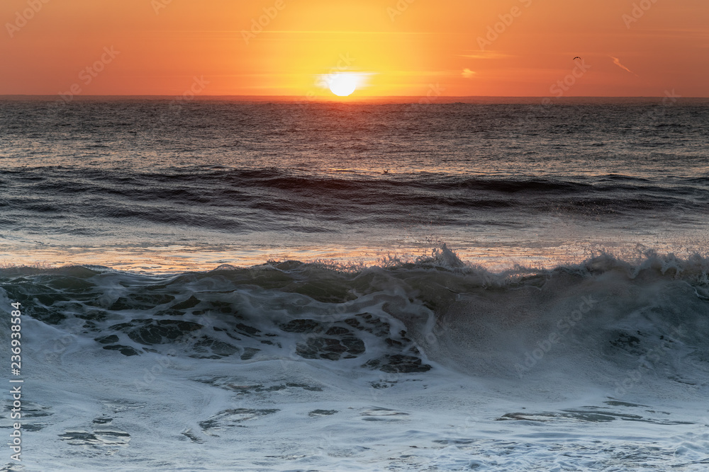 Sunset in Atlantic ocean, Nazare, Portugal.