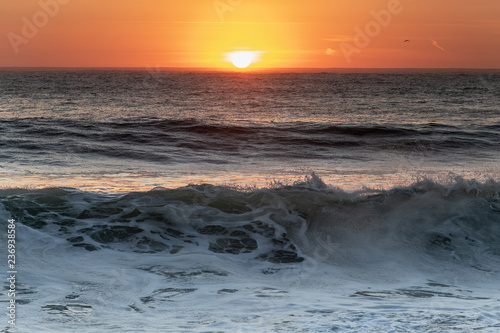 Sunset in Atlantic ocean, Nazare, Portugal.