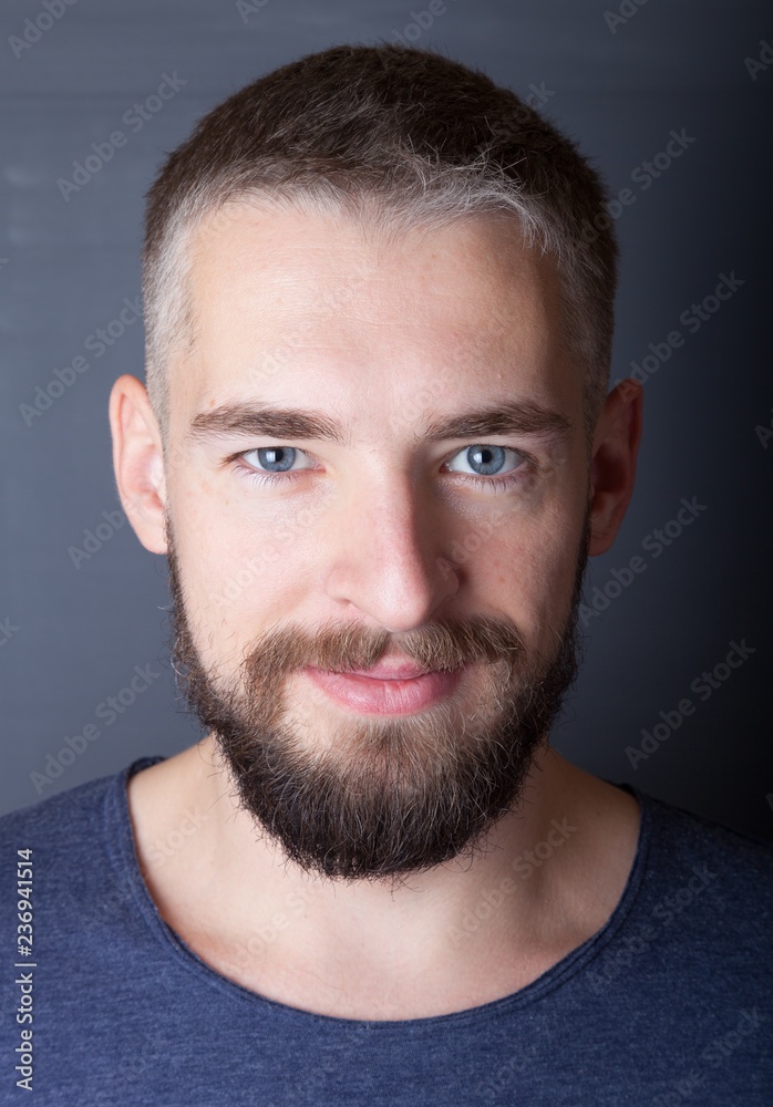 Portrait of a young man with a beard Portrait of a young man with a beard