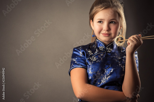 portrait young caucasian girl with roll in hands