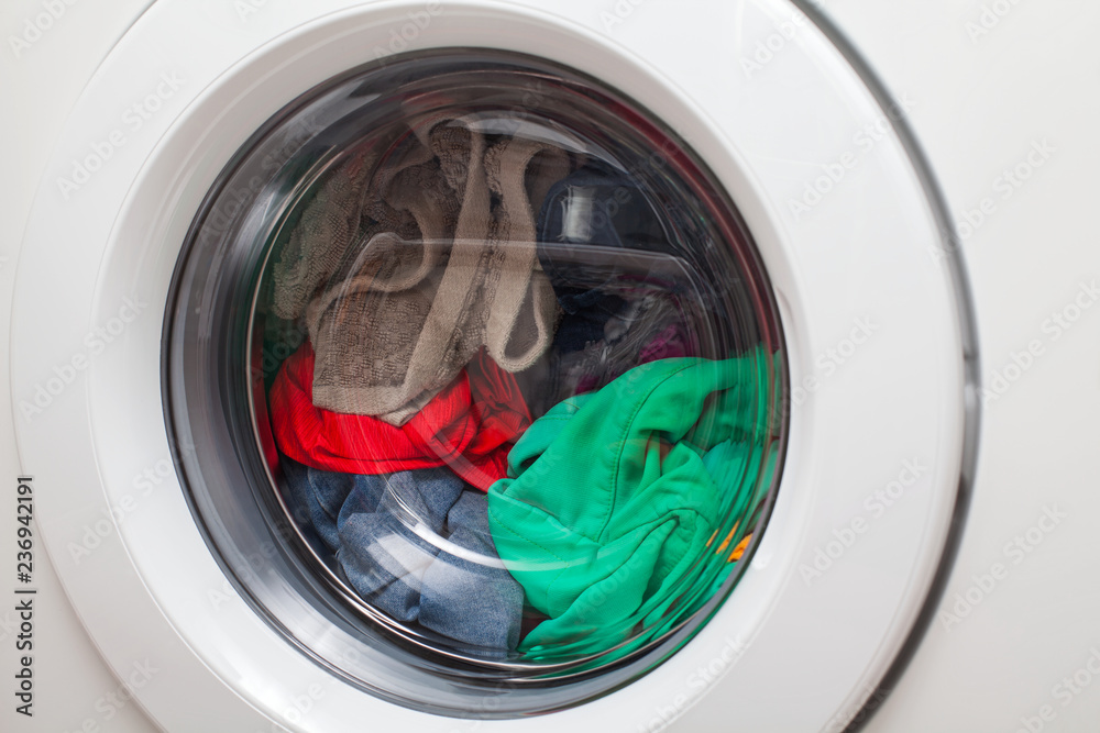 Washing machine loaded with clothes Washing machine loaded with clothes