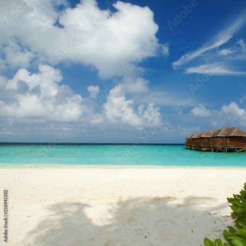 Tropical beach. White sand  blue sky and crystal sea of tropical beach. Ocean beach relax  travel to islands